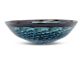 145 A Modern art glass bowl 1999 Etched with indistinct signature and dated With geometric diamond-shaped forms arranged in a swirling optic pattern Height 5 in., diameter 14 3/8 in. Estimate: $300 - $500