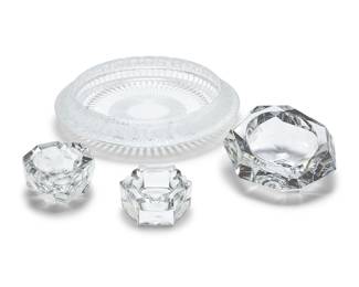 18 A Lalique glass 'Marguerites' bowl and three Baccarat glass ashtrays Late 20th/early 21st century Lalique etched to underside: Lalique ® France; each Baccarat etched with factory mark 4 pieces Bowl height 2 1/2 in., diameter 13 1/8 in.; largest ashtray height 3 1/2 in., width 6 7/8 in., depth 6 3/5 in. Estimate: $300 - $500