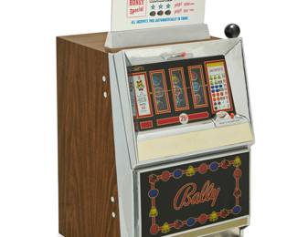 62 A Bally 'Money Honey Special' slot machine Produced 1964-1968 Numbered to factory metal tag: 742A- 426 / 7043 With pull-arm and chromed metal and wood veneered case, electrified Height 33 in., width 20 in., depth 19 1/2 in. Estimate: $300 - $500