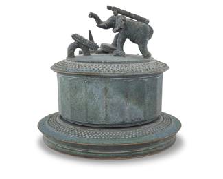 201 Tim Mather (b. 1943) & Annette McCormick (b. 1949) A glazed stoneware figural lidded vessel, late 20th/early 21st century With incised signatures to lid and again inked to bowl underside: MATHER / McCormick The lid with sculpted elephant over a bowl raised on a plinth Overall height 9 3/8 in., diameter 10 1/4 in. Estimate: $300 - $500