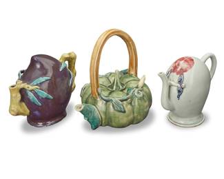 53 Three Chinese Cadogan glazed ceramic teapots Late Qing dynasty (1644-1912) or later One with Chinese wax export seal; gourd marked: D; and incised: 41 Comprising two Cadogan teapots and a possibly Western-made gourd-form teapot 3 pieces Tallest height 8 in., width 8 1/8 in., depth 6 1/2 in; shortest height 5 3/4 in., width 7 3/8 in., depth 3 5/8 in. Estimate: $800 - $1,200