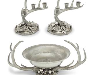 63 A Richard Cipolla pewter table garniture Late 20th century Each impressed: CIPOLLA / PEWTER / 95% / [sun cipher] / ETAIN 95% Comprising a center bowl and pair of three-light candelabra, each of antler form with maple leaves, acorns, and corn cobs at the base 3 pieces Height of bowl with stand 8 7/8 in., width 24 3/4 in.; bowl diameter 14 in.; candelabra height 9 5/8 in., width 10 7/8 in., depth 9 1/2 in. Estimate: $400 - $600