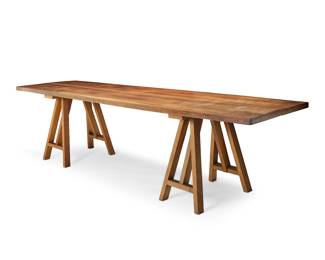 209 A walnut refectory table 20th century The two-plank tabletop raised on two later sawhorse-form supports Overall height 30 3/4 in., length 114 3/4 in., depth 31 1/2 in.; each sawhorse height 28 3/4 in., width 26 1/4 in., depth 16 1/2 in. Estimate: $700 - $900