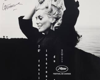 158 After Jack Garafalo (1924-2005) 76th Edition Cannes Film Festival poster, signed by Catherine Deneuve, 2023 Photomechanical reproduction on paper From an edition of unknown size Signed and indistinctly inscribed in ink upper left: C. Deneuve; with text printed as part of the image: "Photo © Jack Garafalo/Paris Match/Scoop-Création Graphique © Hartland Villa" along the right vertical edge Sight: 31 x 23 in. Estimate: $300 - $500