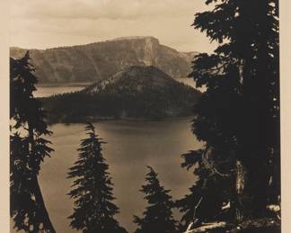 246 Dain L. Tasker (1872-1964) "Crater Lake," 1926 Gelatin silver print on paper mounted to paperboard From the edition of unknown size Signed, titled, and dated in pencil on the paperboard mount, just below the sheet: Dain L. Tasker 1926 Sheet: 12 x 9 5/8 in.; Mount: 18 1/8 x 14 1/8 in. Estimate: $200 - $300
