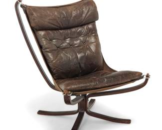 42 Sigurd Ressell (1920-2010) A 'Falcon' chair for Vatne Møbler, 1970s Designed 1971 Unmarked The brown leather and canvas sling chair with a sculptural bentwood frame Height 39 in., width 31 1/4 in., depth 35 3/4 in. Estimate: $300 - $500