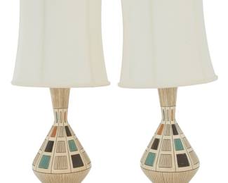 222 A pair of Modern plaster table lamps 1960s Each incised: © QUARTITE CREATIVE CORP 1968 Enameled plaster raised on a gold-toned metal base, each issuing a single light with later fabric shade, electrified 2 pieces Each height without harp 23 in, diameter 8 5/8 in.; height of shades 16 in., diameter 14 1/4 in. Estimate: $200 - $400