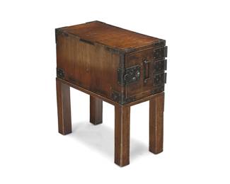 55 A Japanese iron clad wood funa tansu 20th century The ship's chest with a locking front door opening to reveal two locking drawers, raised on a later stand Height of tansu 10 1/2 in., width 11 1/4 in., depth 20 1/2 in.; stand height 12 3/4 in. Estimate: $300 - $500