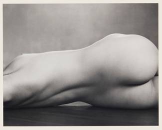 37 Edward Weston (1886-1958) "Nude," 1925, printed by Cole Weston (1919-2003) Gelatin silver print on paper mounted to board From the edition of unknown size and date Stamped in black ink "Negative / by / Edward Weston / Print / by /" and then signed in pencil "Cole Weston", stamped "slightly damaged" in black ink, and inscribed "40N / Nude, 1925" in pencil, all verso Image/Sheet: 6 7/8 x 8 5/8 in.; Mount: 13 3/8 x 15 1/8 in. Estimate: $800 - $1,200