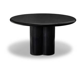 208 A Modern black marble circular table Circa 1970s The round marble tabletop raised on a lobed marble base Base height 28 1/4 in., width 24 in, depth 20 1/2 in.; top diameter 53 3/4 in., height 2 1/4 in. Estimate: $500 - $700
