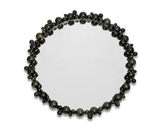 130 A Global Views black bubble circular mirror Early 21st century With factory label applied verso Gunmetal plastic bubble frame Diameter 32 3/4 in., depth 4 in. Estimate: $500 - $700