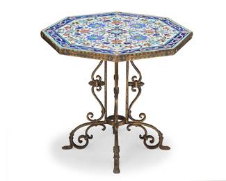 57 A Turkish tile top table 20th century With Iznik tiles and patinated brass base with scrolled feet Height 18 1/2 in., width 20 3/4 in., depth 22 in. Estimate: $700 - $900