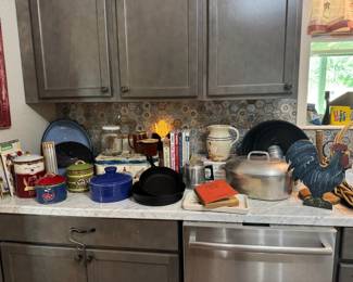 Kitchen plates, cast iron skillets, canister set, vintage percolator, more. 