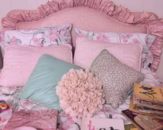 girls upholstered headboard and bedding