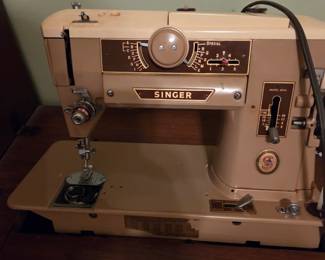 Singer sewing in cabinet