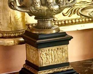 Stunning pair of gilt bronze urns on onyx
