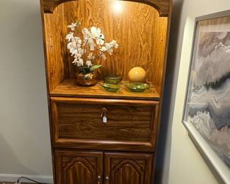 Nice wall unit with light and drop front.