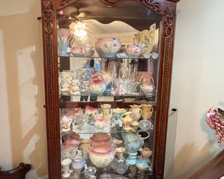 Gorgeous large display cabinet packed to the hilt with pottery.