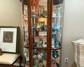 Another view of the large lighted china display cabinet.