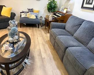 Furniture in the basement area. Very nice 3 cushion divan and large ottoman.