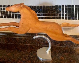 HAND-CARVED HORSE FIGURE ON METAL PEDESTAL