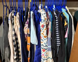Lots of woman's clothing, various sizes and styles