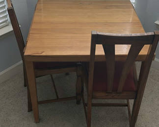 Lot 101: Wooden dining table with chairs