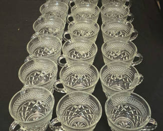 Lot 25: Collection of clear glass teacups with diamond-cut pattern