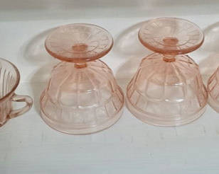 Lot 9: Pink ribbed glassware: cup, small dish, and inverted dessert bowls