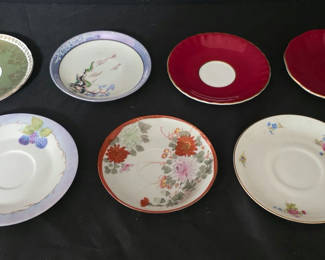 Lot 53: Assorted porcelain plates and saucers with floral and scenic designs