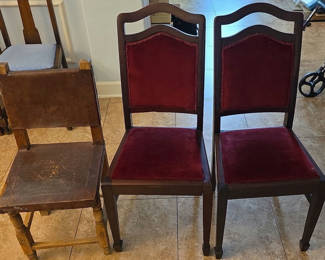 Lot 43: Three wooden dining chairs (two burgundy upholstered, one plain wood with leather seat/backing