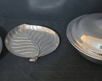 Lot 59: Silver-plated serving pieces: lidded dish, bowl, leaf plate, and oval platter