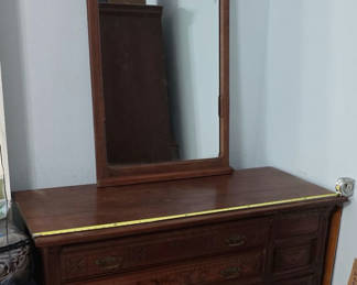 Lot 21: Antique wooden dresser with attached mirror