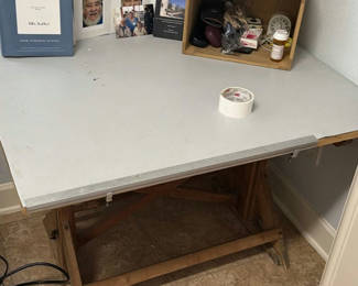 Lot 112: Metal-top drafting table on a wooden trestle frame *Table ONLY**