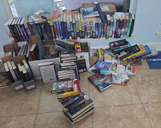Lot 45: Assorted fiction books in stacks and boxes