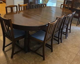 Lot 40: Oval dining table with 3 10" inserts and 10 chairs
