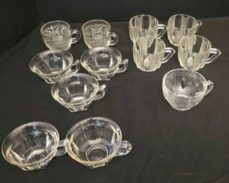 Lot 27: Clear glass teacups, mugs and etched bowls