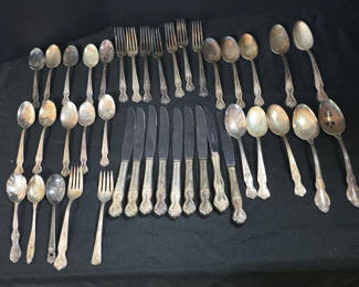 Lot 50: Assorted silver-plated flatware set (forks, spoons, knives)
