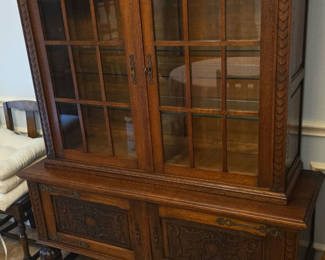 Lot 39: Oak china cabinet with glass display and carved lower storage