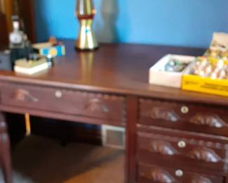 Carved Walnut desk and lava lamp