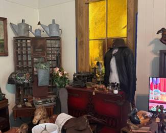 Saddle, Harley leather jacket, vintage mail slots, galvanized water cans
