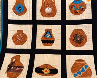 Southwest quilt with turquoise and feather detail