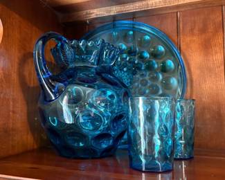 Fenton Art Glass in Blue Coin Dot pattern. Includes pitcher, two drinking glasses and platter.