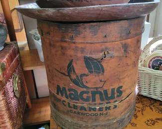 A fantastic piece of vintage advertising and Americana! This original Magnus Cleaners of Garwood, New Jersey wooden advertising barrel is featured alongside hand-carved wooden dough bowls and rustic country décor at this Danbury, CT private estate sale. Browse antique advertising, primitive woodware, farmhouse décor, vintage signs, folk art, advertising collectibles, and one-of-a-kind estate treasures throughout the home. A must-see for collectors of Americana, country antiques, advertising memorabilia, and rustic home décor. Everything must go!