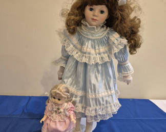 Lot 194: Two Porcelain Doll And Small Plastic Doll in Lace Dresses