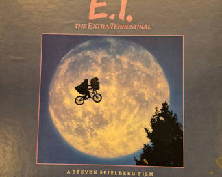 Lot 63: E.T. The Extra-Terrestrial memorabilia: VHS box, poster, and artwork