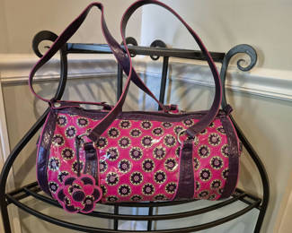 Lot 95: Vera Bradley pink patterned handbag with purple trim and flower charm