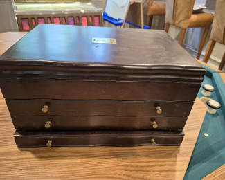 Lot 32: Dark wood multi-drawer jewelry box with velvet interior
