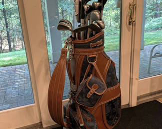 Lot 169: Golf bag with clubs and headcovers