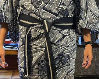 Lot 83: Kimono-style robe with obi belt and folded dashiki garment